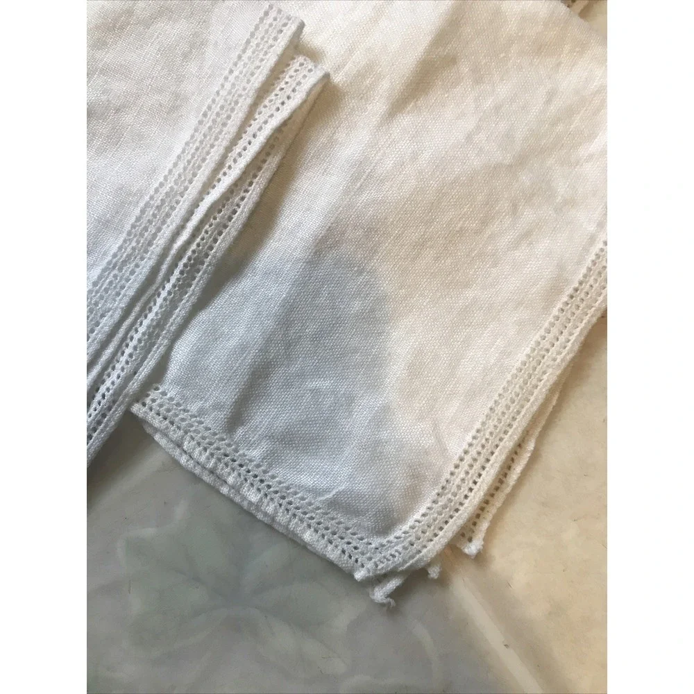 Set of Four White Linen Like Punched Pattern Napkins Delicate Edging